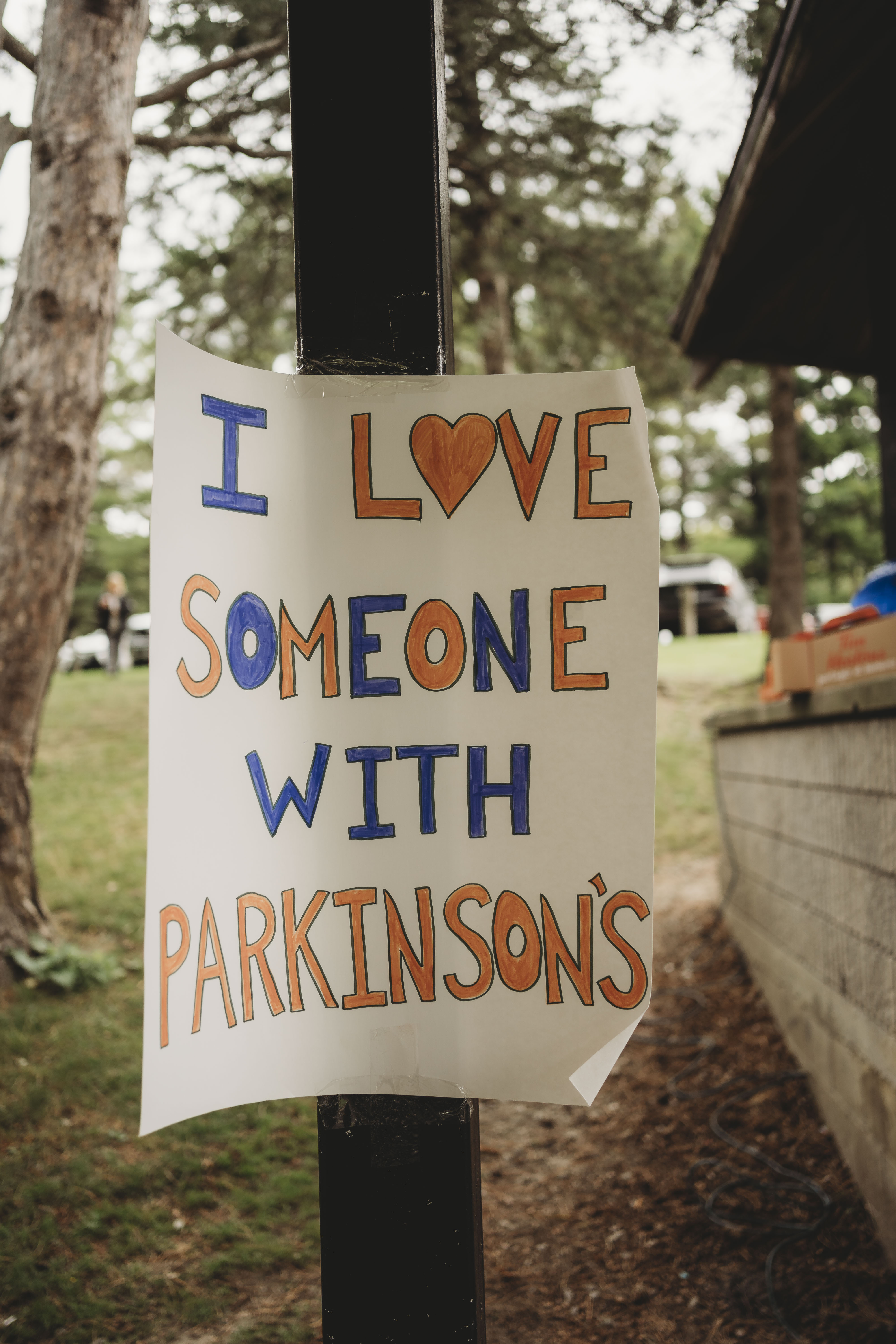 A handmade sign reading "I love Someone with Parkinson's" showing support for the Parkinson's community.